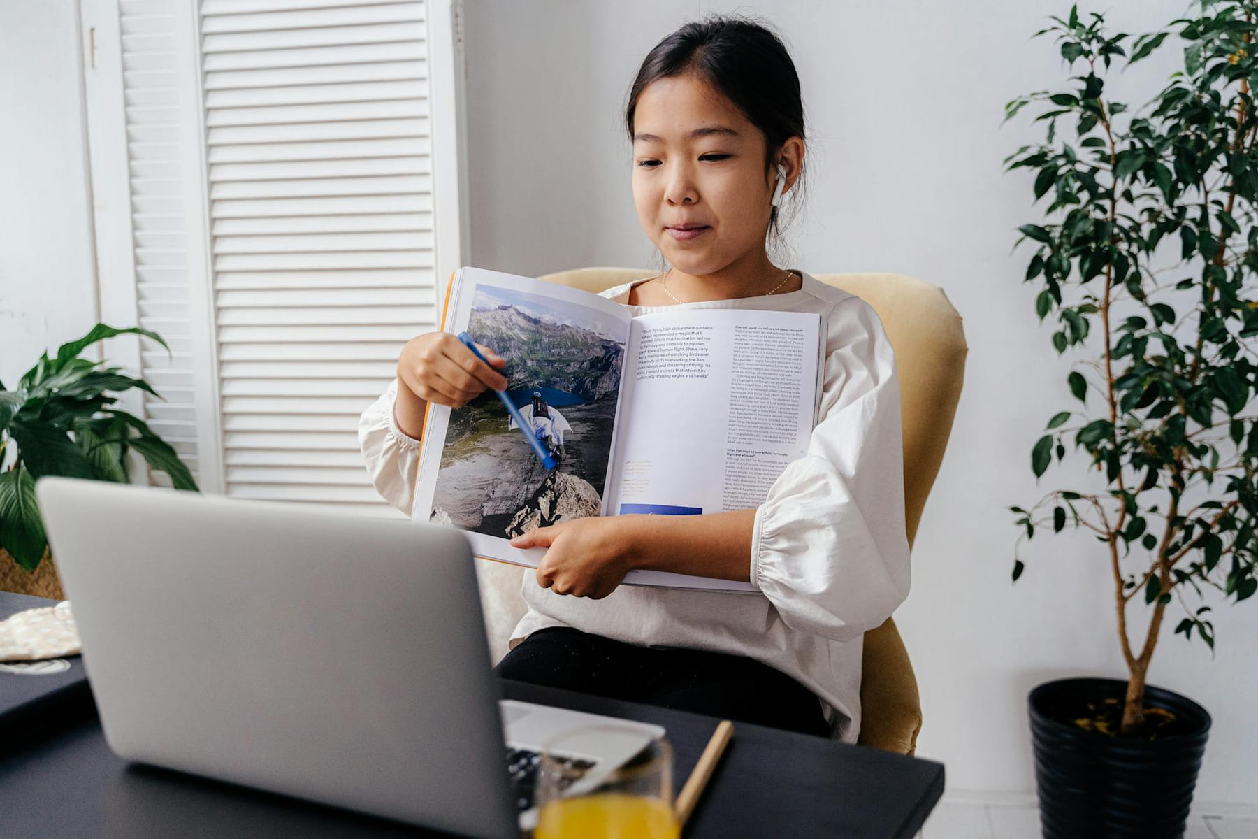 A young girl interacting with an online learning session at home, showcasing technology in education. on Skill Forge