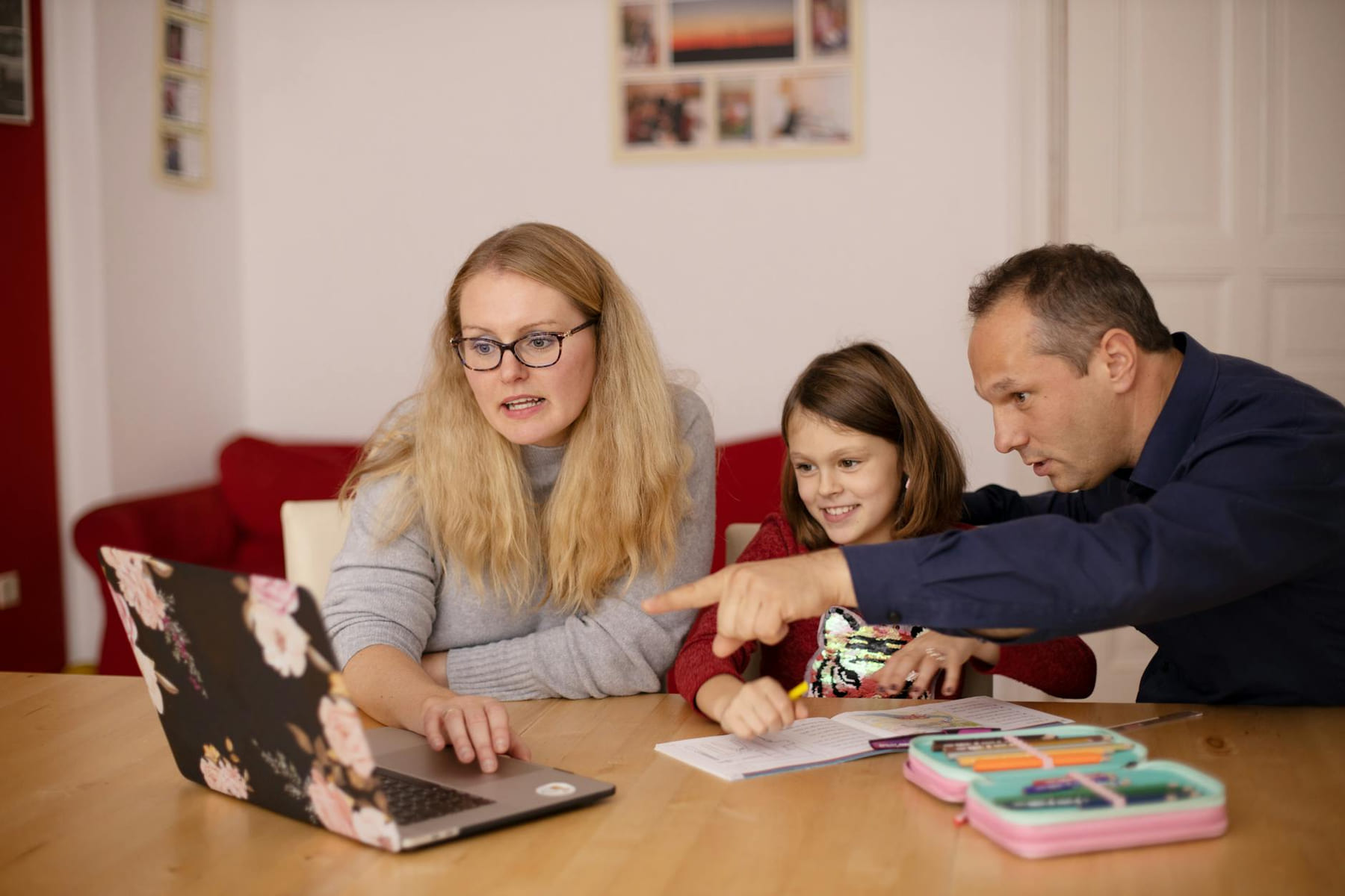 A family learning together with a laptop at home, emphasizing collaboration and education. on Skill Forge